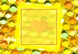 yellow glow frame as copy space on yellow abstract balls background