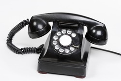 An old bakelite dial phone.