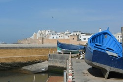 Morocco, Essaouira - blue boats in front of the medina