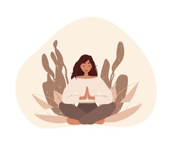 The woman is sitting in the lotus position, hands are connected. Woman doing reiki, spiritual healing concept. Woman in meditation. 