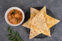Godamba Rotti and Paratha with Chicken Masala Curry Kerala, India, Sri Lanka