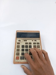 holding old calculator, vintage calculator, on whitebackground