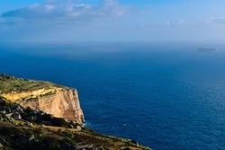 Amazingly beautiful cliffs of Dingli, Malta in the light of the setting sun overlooking the deep blue Mediterranean Sea. These are the highest and most famous cliffs on the island.