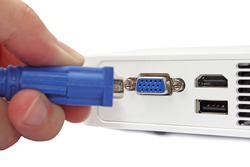 hand plugging VGA cable connector 