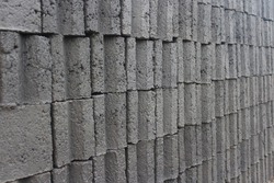 
pile of cement bricks. Cement brick is one of the main materials that are often used for the manufacture of building walls