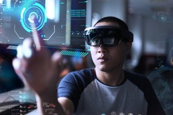 Portrait of young men with 3D virtual reality glasses hololens | Young student experiments virtual reality world in the lab
