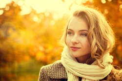Portrait of Young Fashion Woman Outdoor on Autumn Background. Toned Photo with Bokeh and Copy Space.