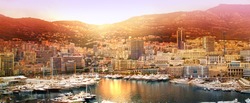 Monte Carlo marine with yachts and sail boats and town view at sunset. Monaco