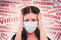 a woman with a mask on his face, scared by the news of the coronavirus covid-2019. Panic situation. Fear of getting sick. concept of the spread of coronavirus. The patient is scared covid 19.