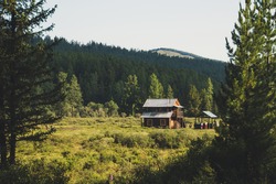 A log cabin in the hunting field, Siberia, Altai. Two-storey house. recreation in the Altai mountains