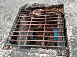 old rusty metal drain on the floor
