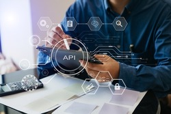 API - Application Programming Interface, woman using laptop, tablet and smartphone with virtual screen API icon Software development tool, modern technology and networking concept.