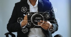 Zero trust security concept Person using computer and tablet with zero trust icon on virtual screen of Data businesses.