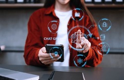 Woman using chatbot in computer and tablet  smart intelligence Ai.Chat GPT Chat with AI Artificial Intelligence, developed by OpenAI generate. Futuristic technology, robot in online system. in office