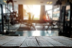 fitness gym and wooden table space in morning light