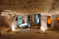 The Derinkuyu underground city is an ancient multi-level cave city in Cappadocia, Turkey. Stone used as a door in the old underground city