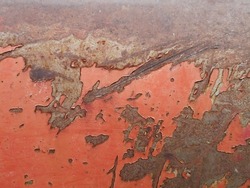 red background, rusty surface, red rusty surface of an old car close-up