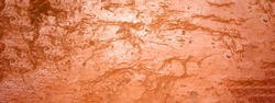 Texture of red decorative plaster or concrete. Abstract grunge background for design.