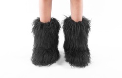 black fur boots isolated on white background