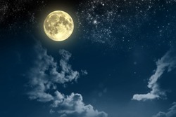 Beautiful magic blue night sky with clouds and fullmoon and stars