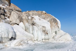 Rocks frozen in the ice Baikal Lake, in winter