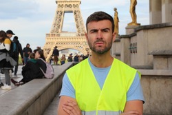 French protester in front of the Eiffel Tower