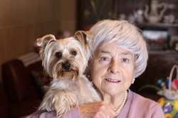 Older woman and her lap dog