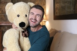 Adult man showing love for teddy bears