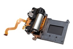 Isolated shutter motor unit of a modern digital single-lens reflex camera on a white background