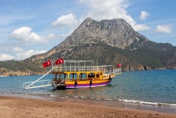 Boat is waiting opening summer season , Adrasan beach in Antalya , Mountain sea and Beach together