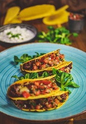 Shot of a Taco shells with filling 