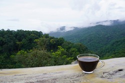 Drink Arabica coffee on vacation. in the midst of nature, forest