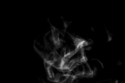 White smoke steam with swirl wave shape on isolated solid black wallpaper backgrounds use as a overlay effect for food vapor and dry ice 