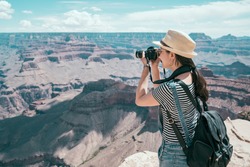 tourist photographer taking photo of sand mountain desert in the sunny day. young lens man hobby love travel wild. girl living healthy active lifestyle doing hike in beautiful nature landscape to US.