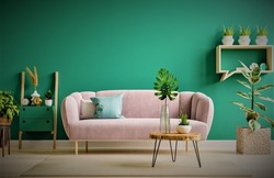 Green interior in modern interior of living room style with soft sofa and green wall