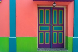 Colorful walls of houses in the city of Flores, Guatemala.