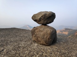 Stones balanced by gravity close up image
