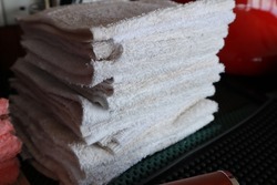 a pile of rags or scraps of cloth used as a rag for dirt or spilled drinks. wipes for coffee spills on the coffee maker