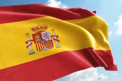 Spain Flag Waving in the Wind on Flagpole, on sky background