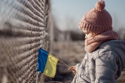 Girl holding Ukrainian flag, asking for peace, children against war, kids in danger, freedom, stop fighting, Blue Yellow