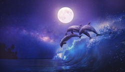 Night ocean with three playful dolphins leaping from sea on surfing wave and full moon shining on tropical background