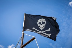Pirate flag with blue sky skull and crossbones