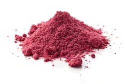 heap of dried beet root powder macro isolated on white background, selective focus