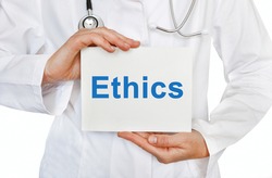 Ethics card in hands of Medical Doctor