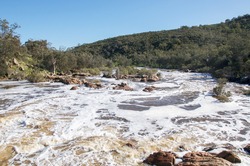 The Bell Rapids white water where the Avon and Swan River meet in Brigadoon in the Swan Valley region in Western Australia/Flowing Bell Rapids/Brigadoon, Swan Valley Region, Western Australia