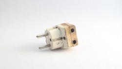 Photo of a used electric plug that is dirty but still usable with a white background
