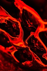 Abstract red liquid matter close up