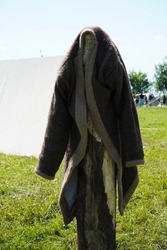 Ulyanovsk, Russia - July 16, 2022: historical Festival (The Great Volga Way). Historical reconstruction. Middle Ages. A coat made of wool is dried in the sun. Traditional outerwear