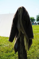 Ulyanovsk, Russia - July 16, 2022: historical Festival (The Great Volga Way). Historical reconstruction. Middle Ages. A coat made of wool is dried in the sun. Traditional outerwear