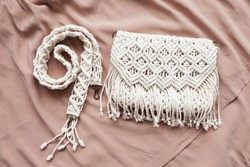 Handmade macrame cotton сross-body bag. Eco bag for women from cotton rope. Scandinavian style bag.  Creme tones, sustainable fashion accessories. Close up image